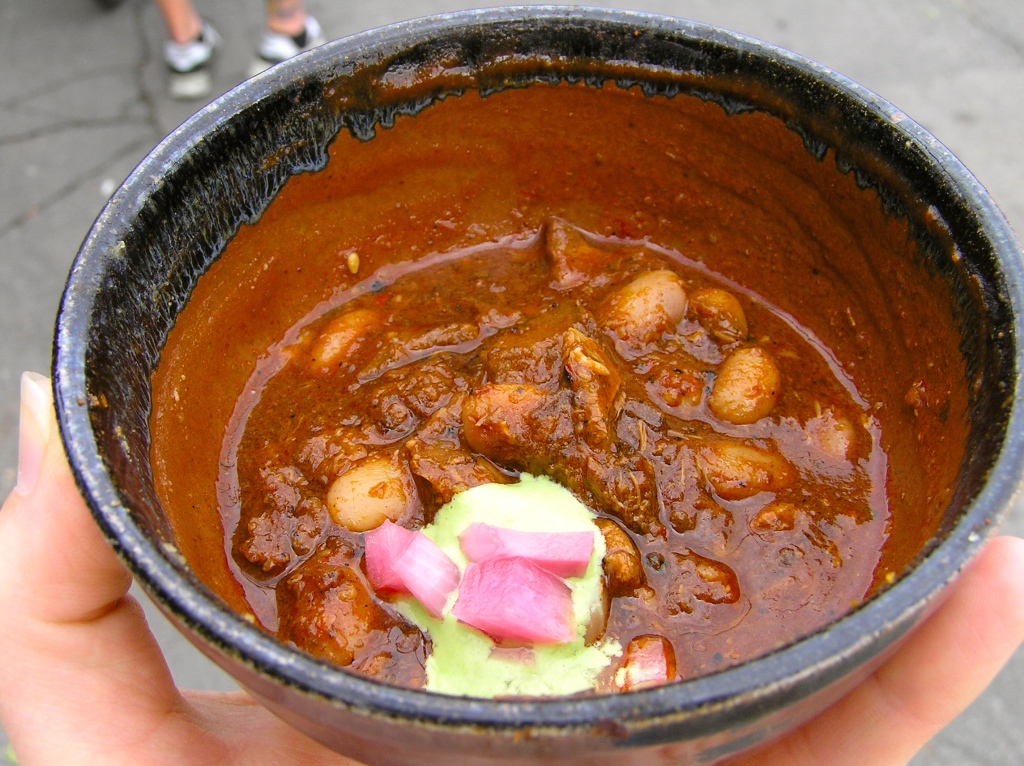 This chili from was served with a dab of cilantro sour cream and pickled onions.