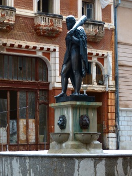 Created over one hundred years ago, this sculpture of the town's namesake has weathered time well. The buildings over which he stands watch have not.